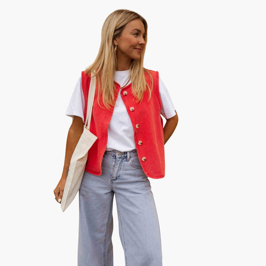 Women’s sleeveless vest with button front and vintage-washed finish