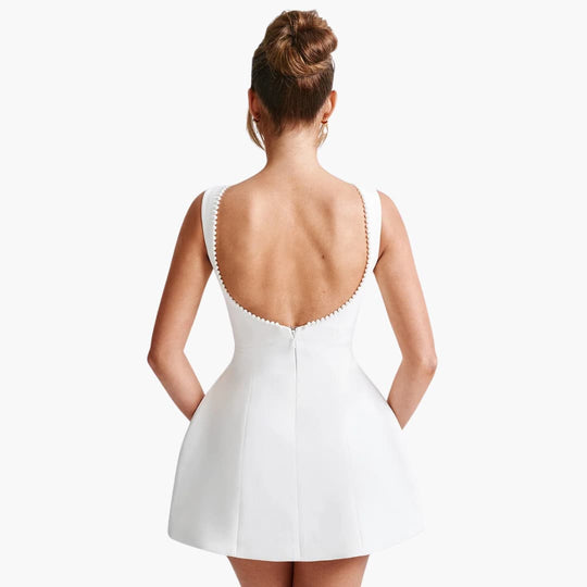 Women’s sleeveless mini dress with pearl and fitted bodice